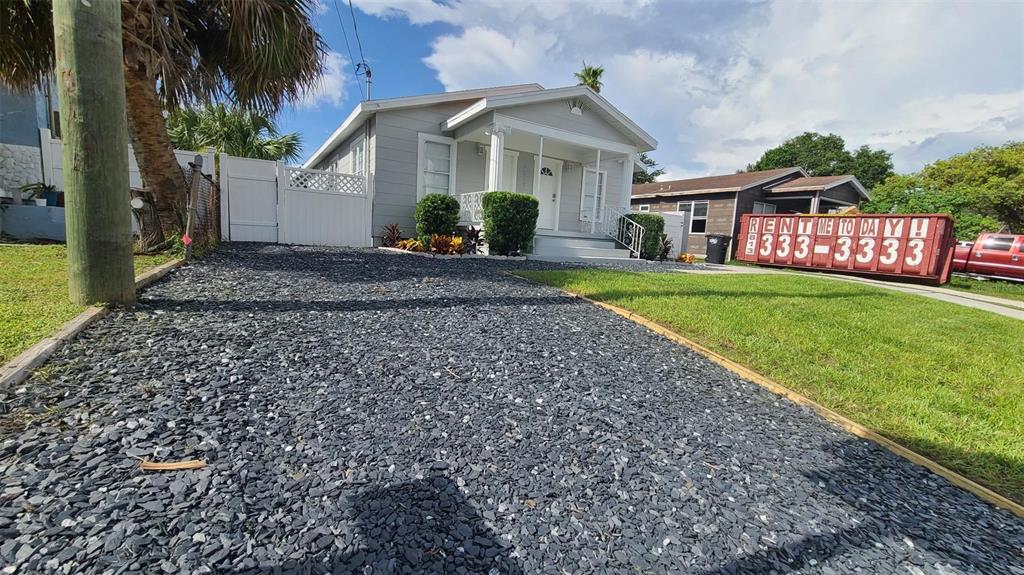 2519 West Walnut Street Tampa, FL 33607 - Photo 2 of 19 a front view of a house with garden