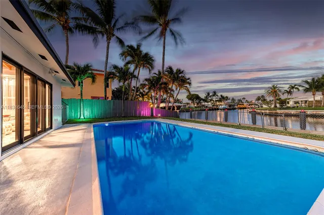a view of swimming pool with outdoor seating