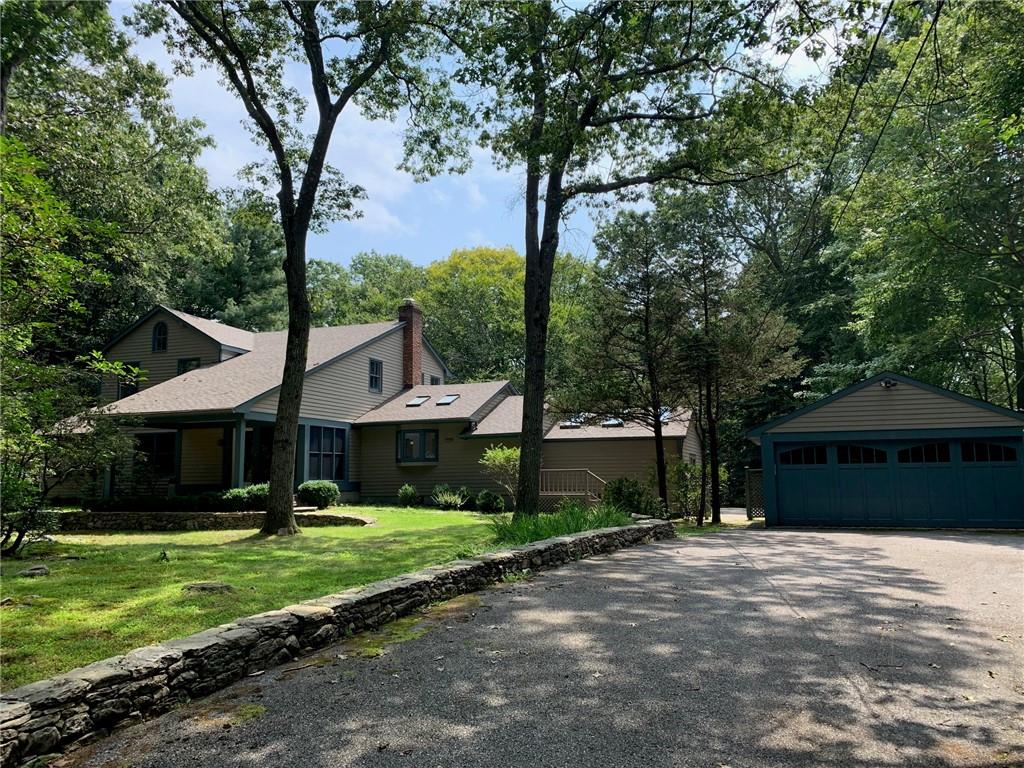 25 East Kinnicut Road Pound Ridge, NY 10576 - Photo 1 of 1 a front view of a house with garden