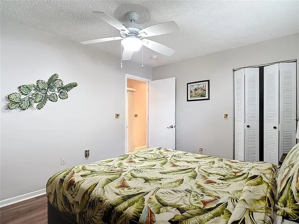 a bathroom with a sink a toilet and shower curtain