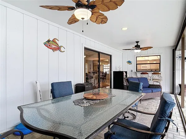 a view of a backyard with a patio and swimming pool table