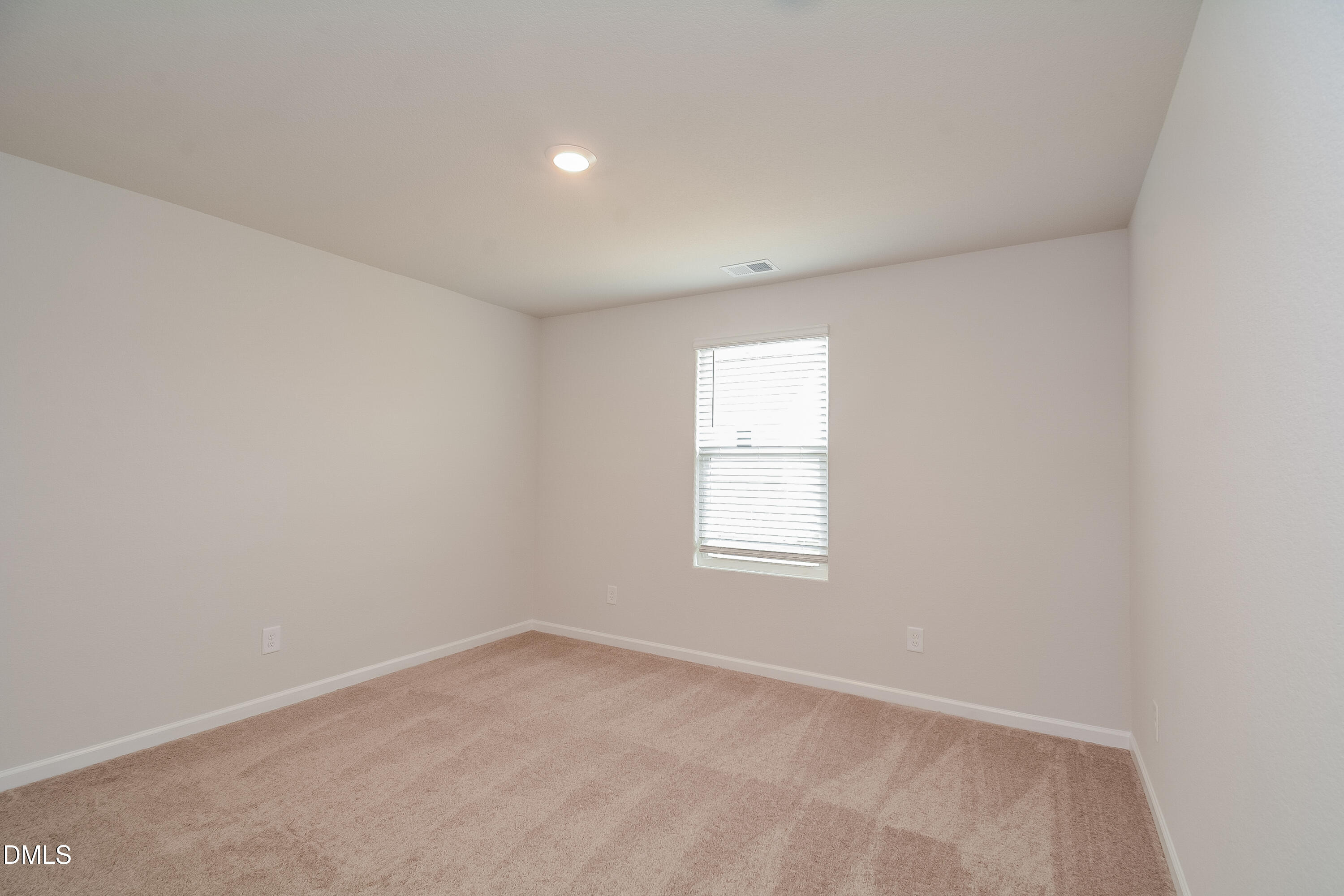 348 Gourd Street Zebulon, NC 27597 - Photo 12 of 17 an empty room with a window