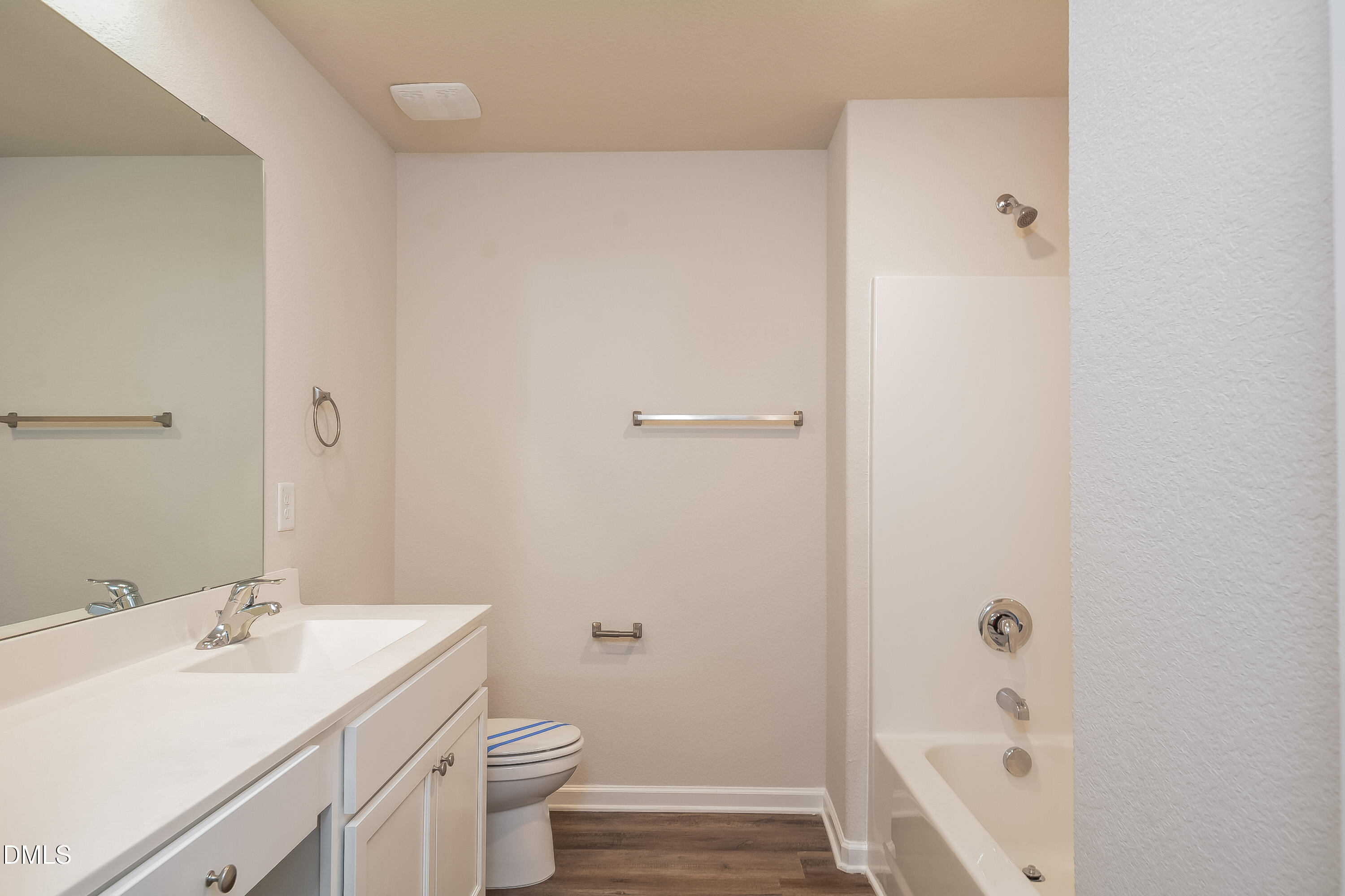 348 Gourd Street Zebulon, NC 27597 - Photo 14 of 17 a bathroom with a sink a toilet and shower