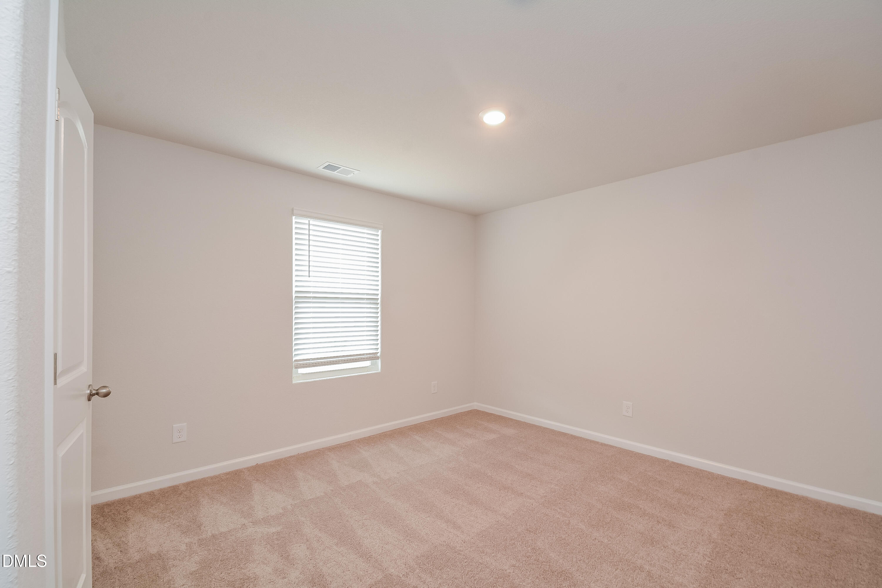 348 Gourd Street Zebulon, NC 27597 - Photo 10 of 17 an empty room with windows