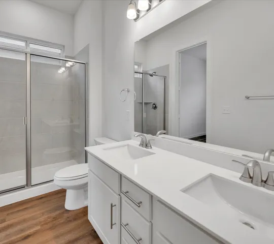 a bathroom with a sink toilet and shower