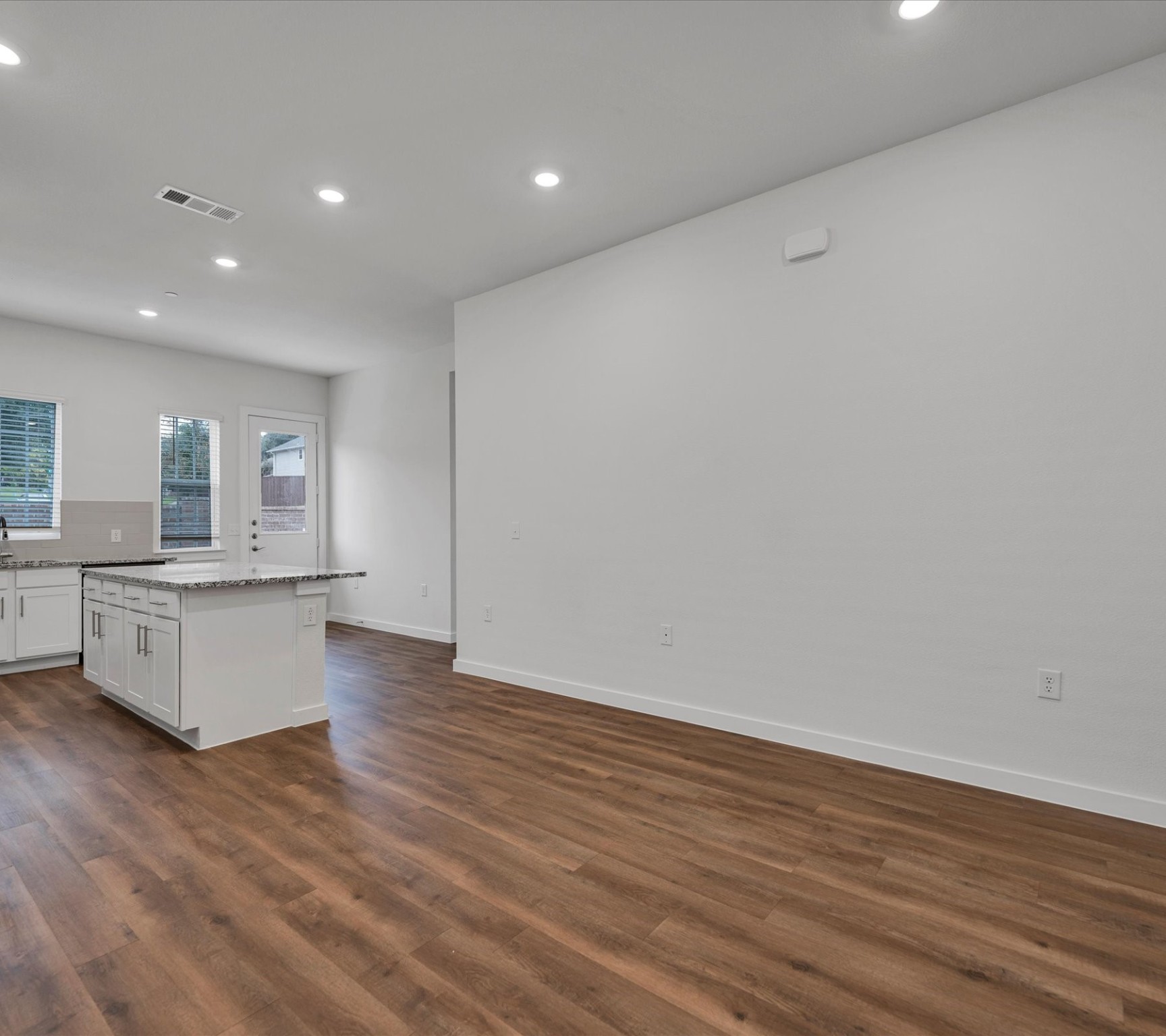 2709-101 Rockhill Road McKinney, TX 75072 - Photo 6 of 21 a large kitchen with wooden floor and a sink