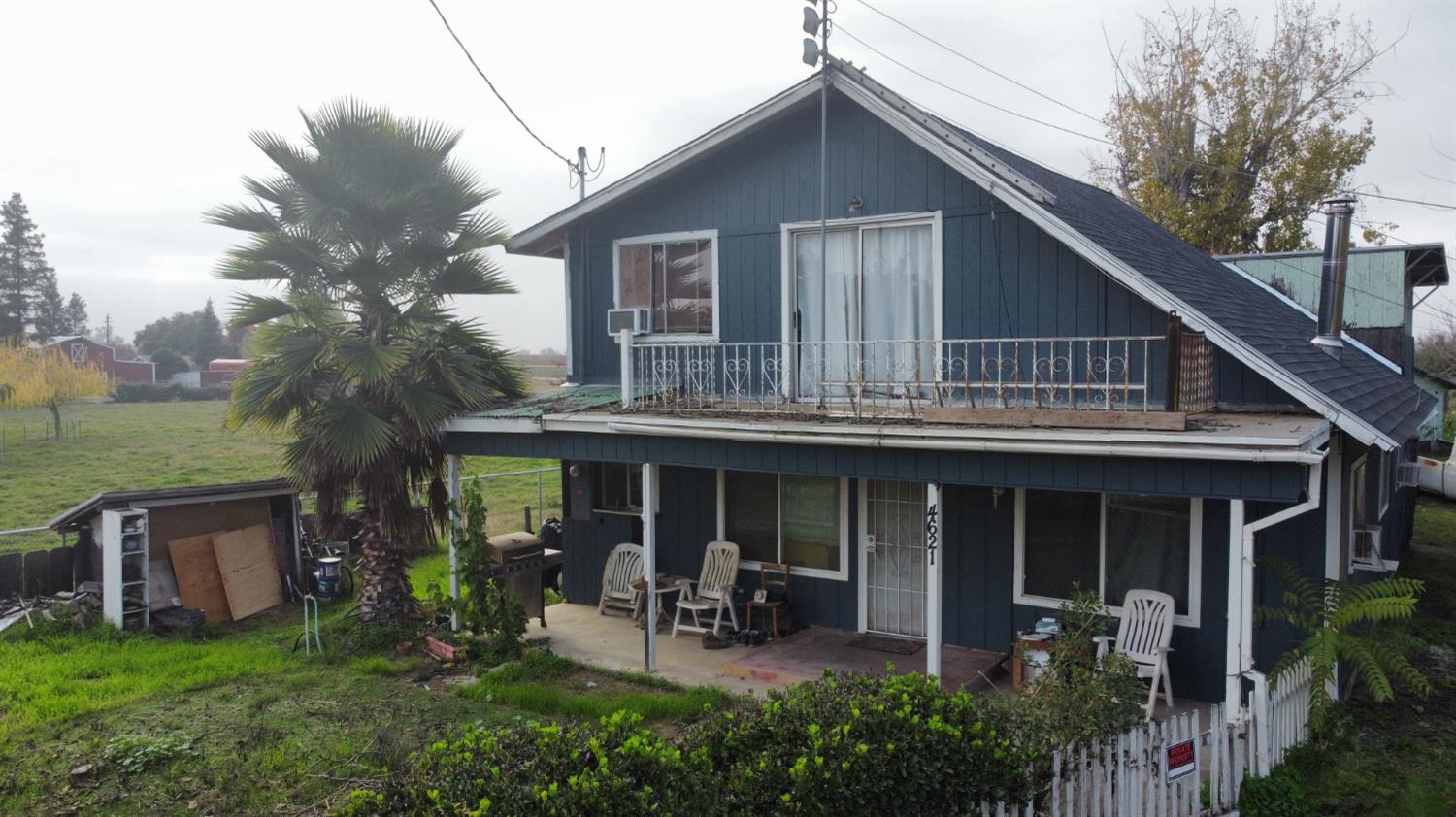 4621 Swanson Road Denair, CA 95316 - Photo 38 of 58 a front view of house with a garden and patio