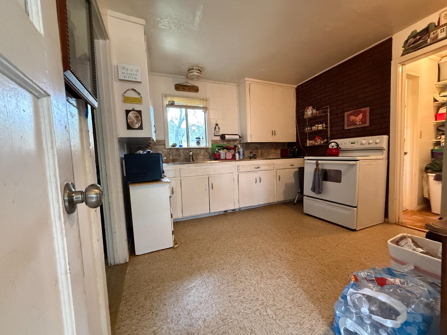 4621 Swanson Road Denair, CA 95316 - Photo 47 of 58 a kitchen with lot of cabinets and refrigerator