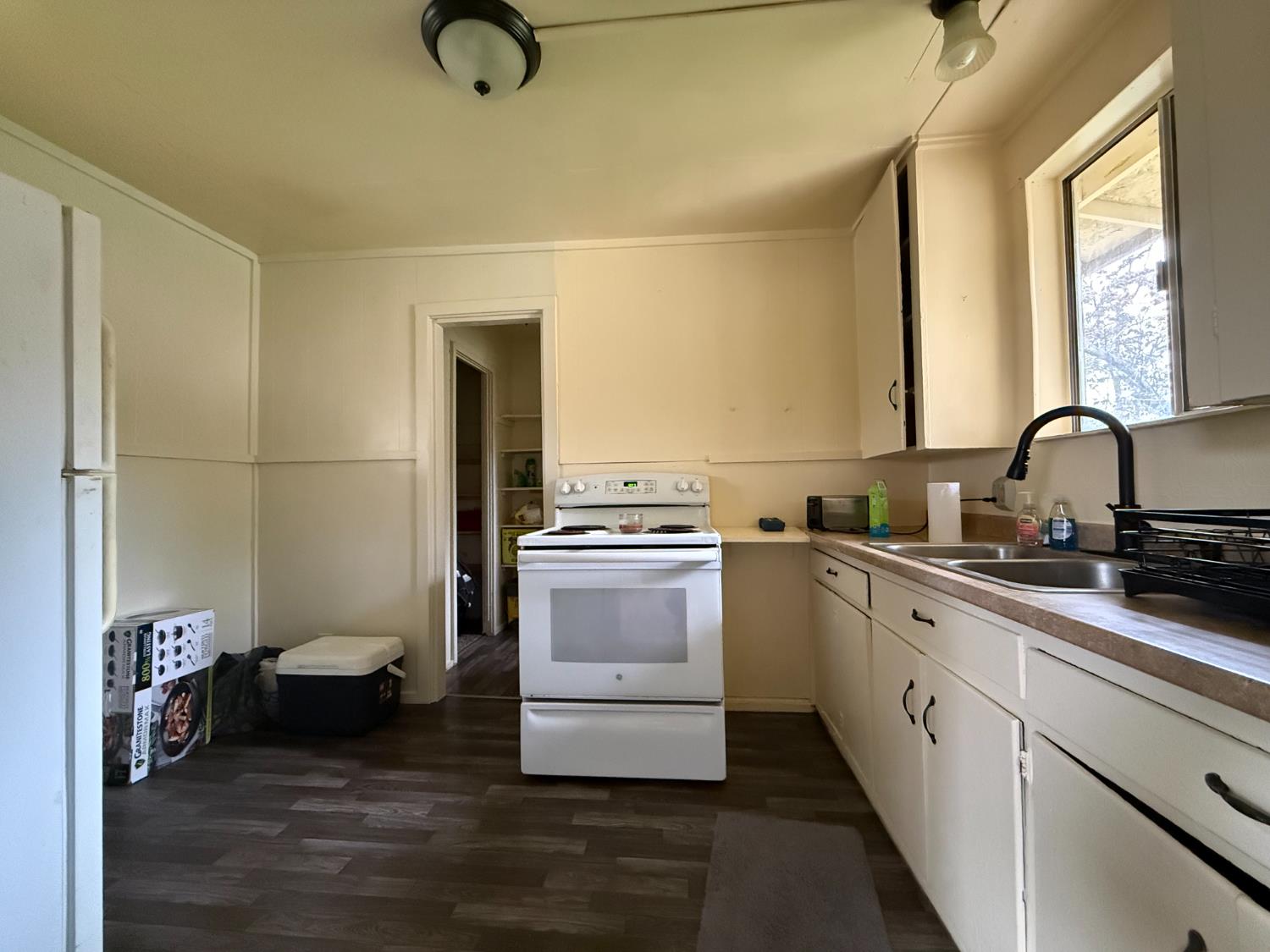 4621 Swanson Road Denair, CA 95316 - Photo 54 of 58 a kitchen with a refrigerator and a sink