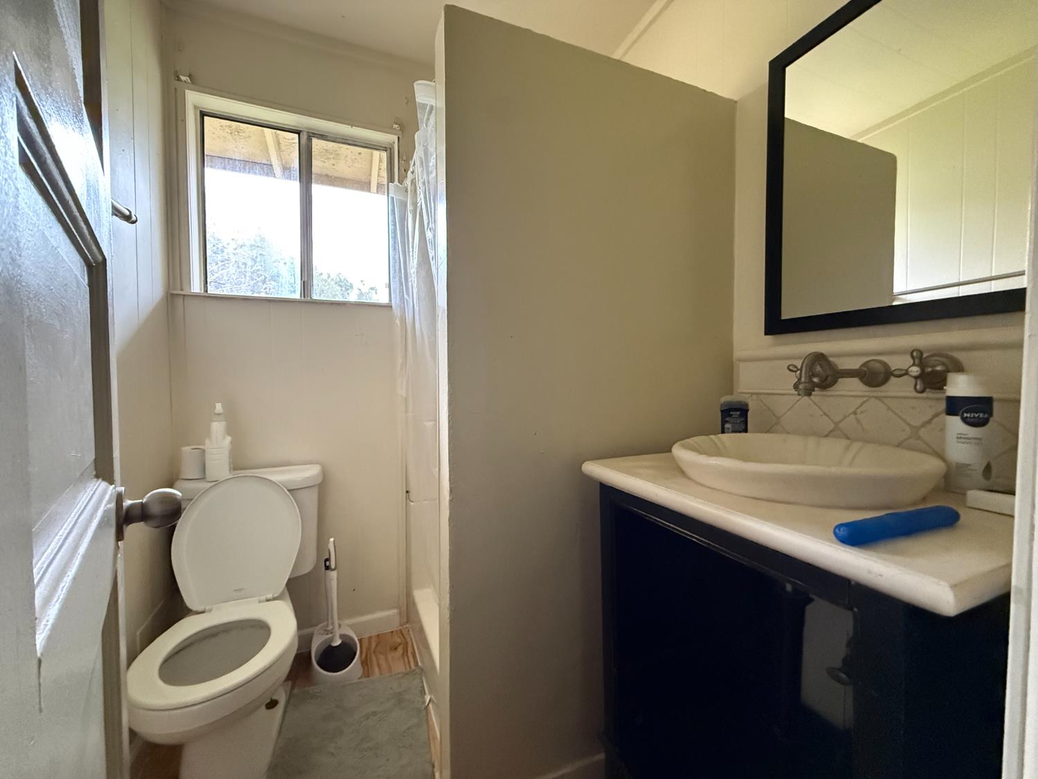 4621 Swanson Road Denair, CA 95316 - Photo 56 of 58 a bathroom with a granite countertop toilet sink and mirror