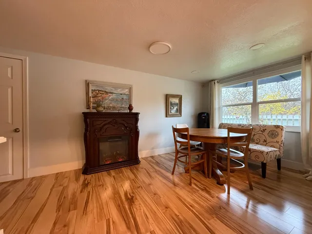 a living room with furniture and a clock