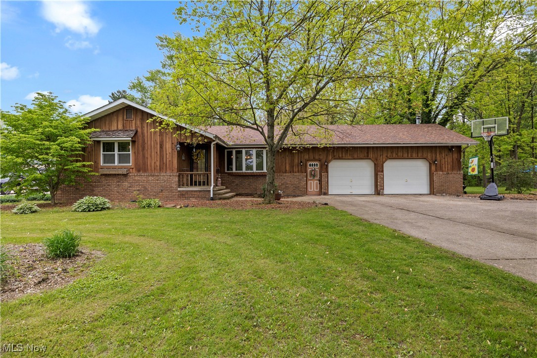 11811 Robson Road Grafton, OH 44044 - Photo 1 of 50 Ranch-style home featuring brick siding, a garage, a front yard, and concrete driveway