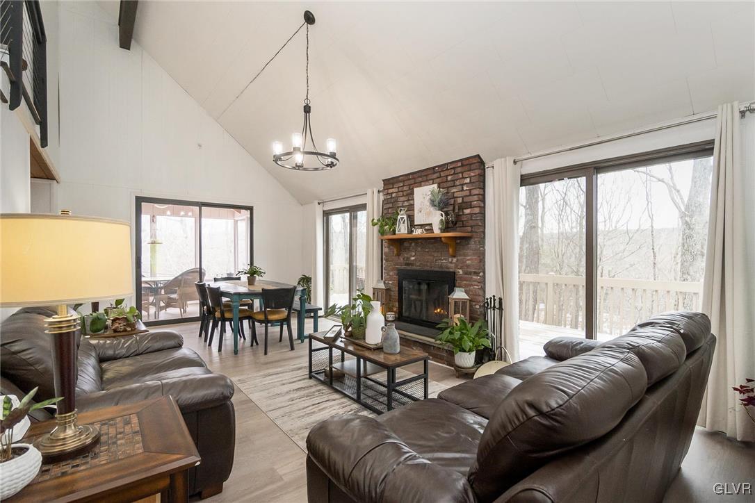 5967 Decker Road Bushkill, PA 18324 - Photo 11 of 47 a living room with furniture dining table and a large window