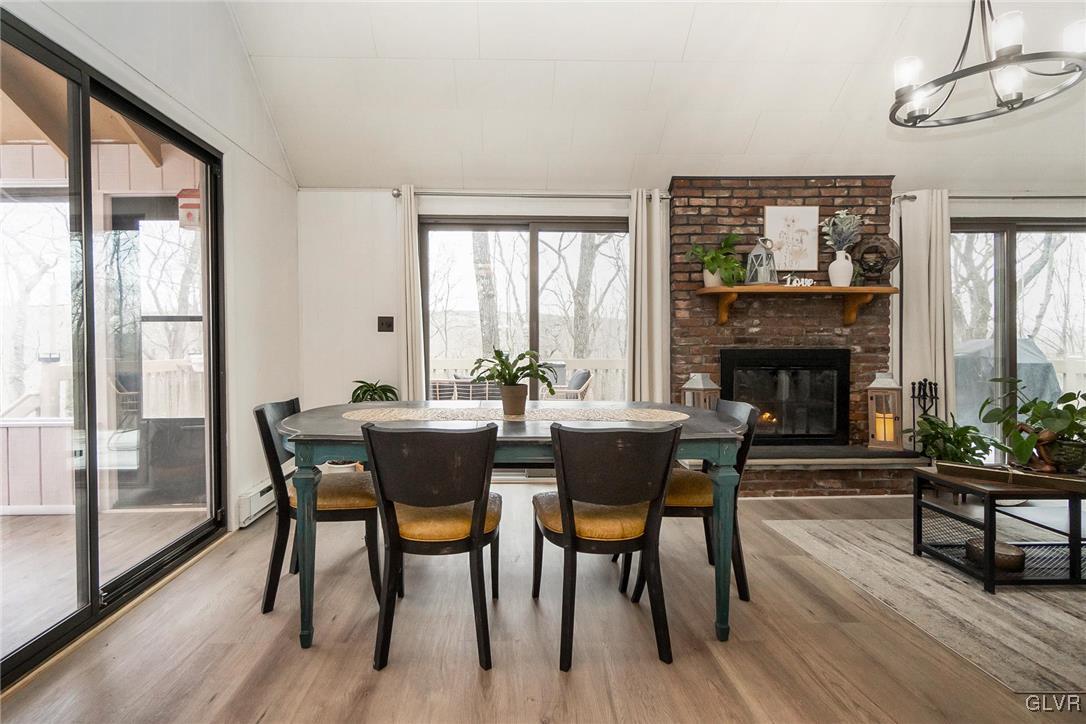 5967 Decker Road Bushkill, PA 18324 - Photo 16 of 47 a view of a dining room with furniture window and wooden floor