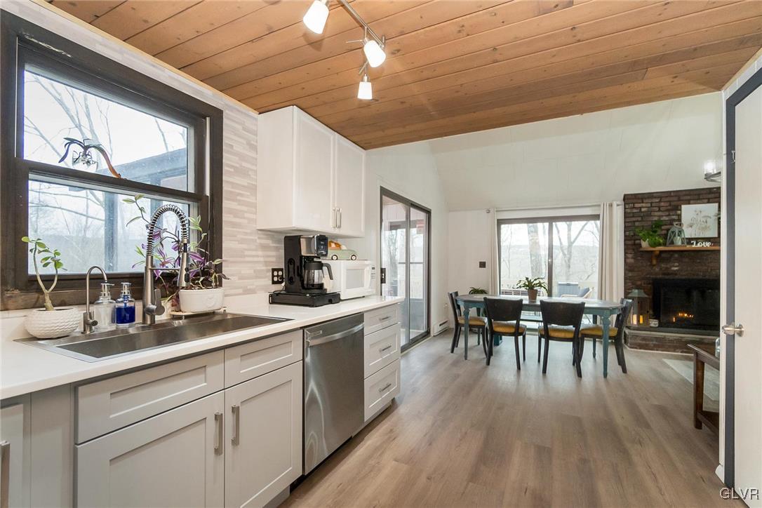 5967 Decker Road Bushkill, PA 18324 - Photo 19 of 47 a kitchen with lots of counter top space and dining table