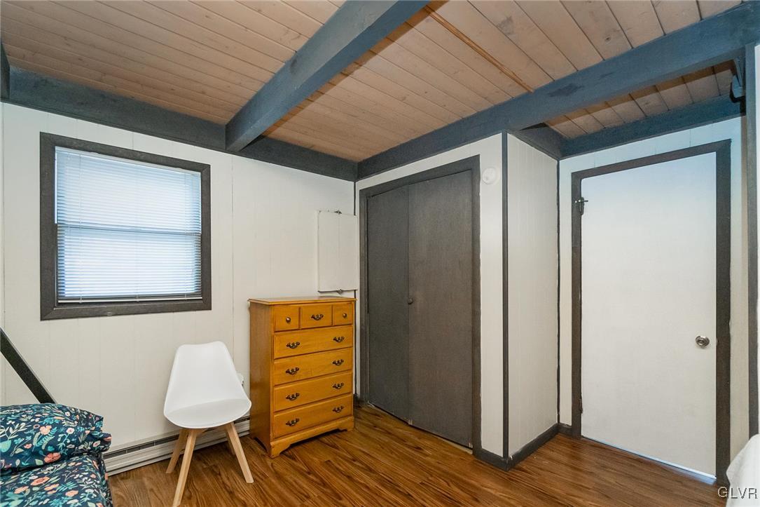 5967 Decker Road Bushkill, PA 18324 - Photo 29 of 47 a room with furniture and wooden floor