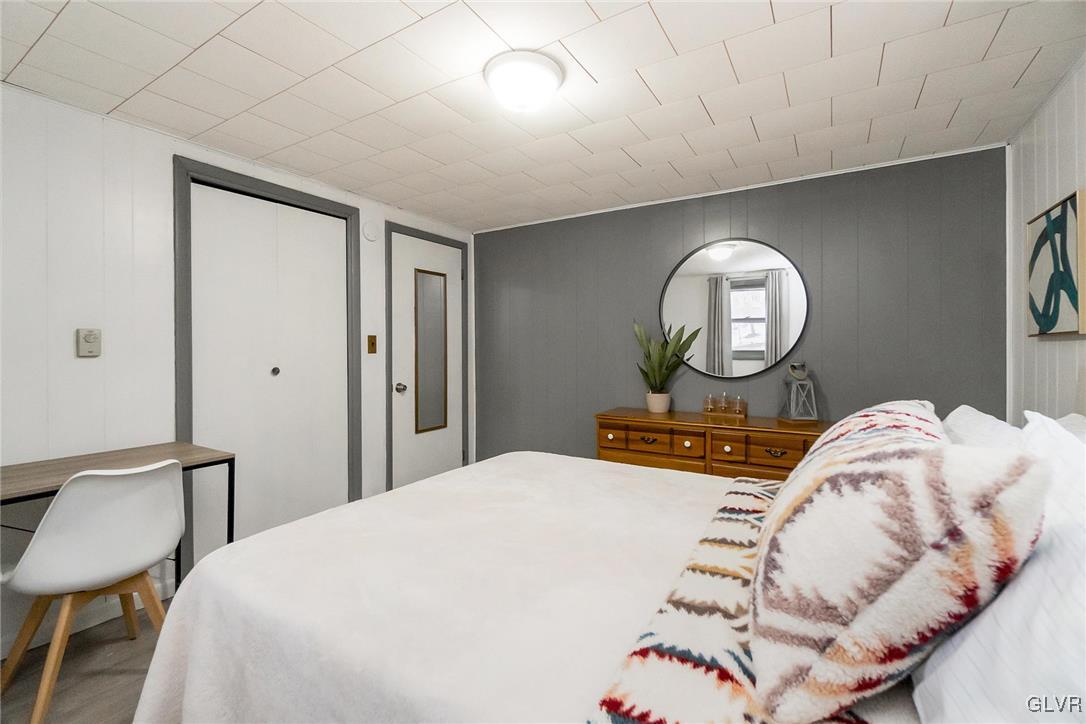 5967 Decker Road Bushkill, PA 18324 - Photo 35 of 47 a bedroom with a bed and window