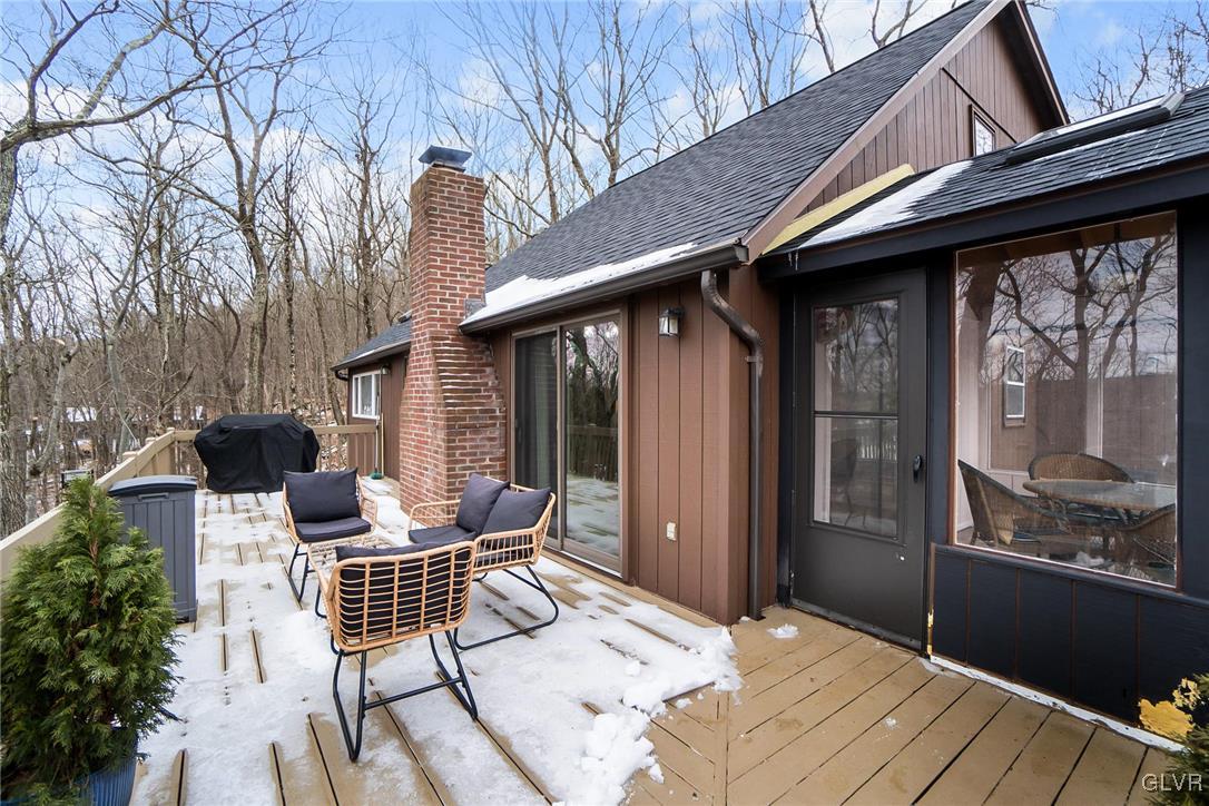 5967 Decker Road Bushkill, PA 18324 - Photo 42 of 47 a backyard of a house with table and chairs