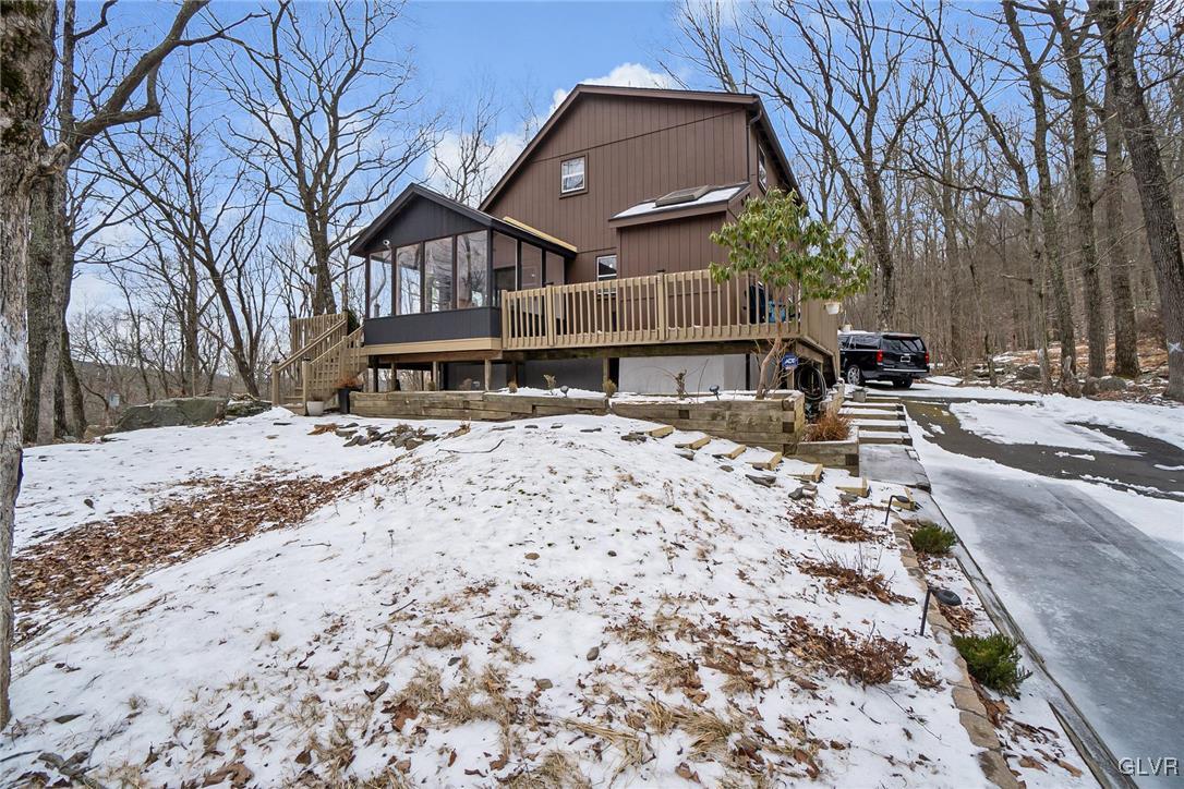 5967 Decker Road Bushkill, PA 18324 - Photo 5 of 47 a front view of a house with a yard covered with snow