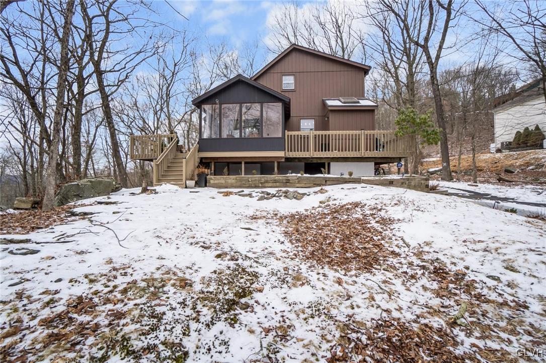 5967 Decker Road Bushkill, PA 18324 - Photo 7 of 47 a front view of a house with a yard covered in snow