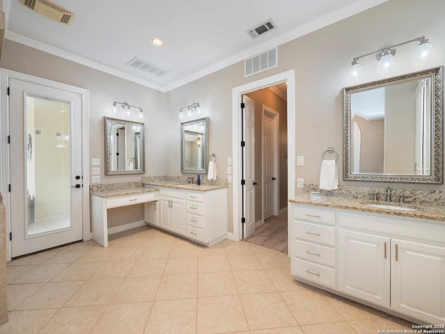 429 Fossil Hills Loop Spring Branch, TX 78070 - Photo 20 of 64 a large bathroom with a granite countertop sink mirror and a