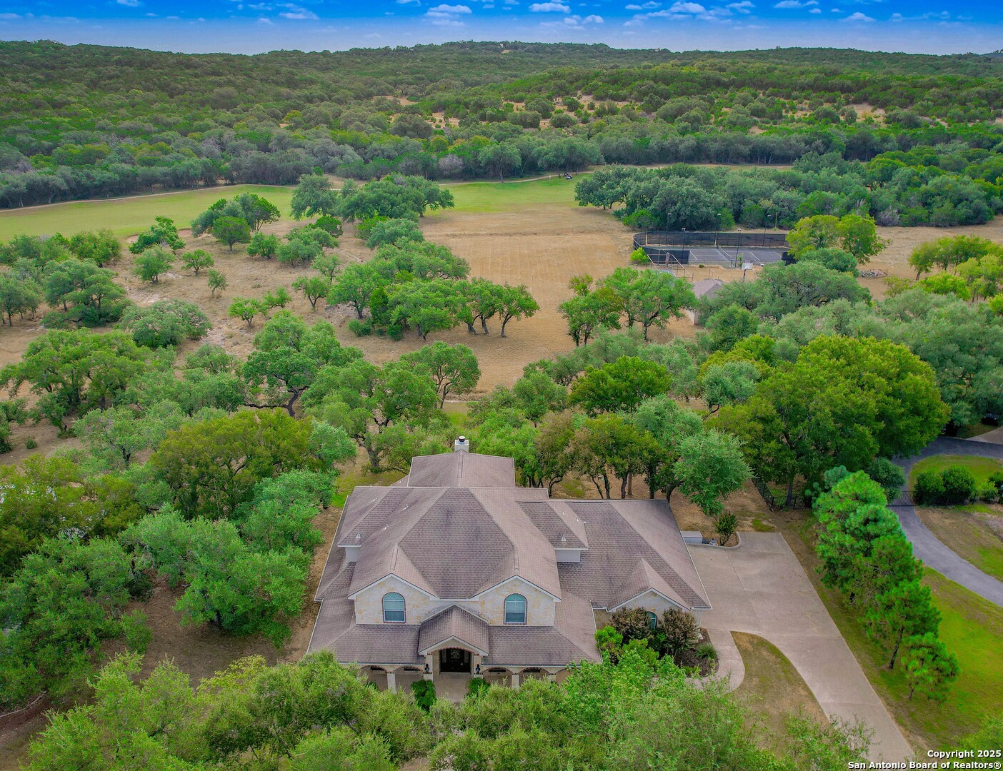 429 Fossil Hills Loop Spring Branch, TX 78070 - Photo 2 of 64 an aerial view of a houses with a lake view
