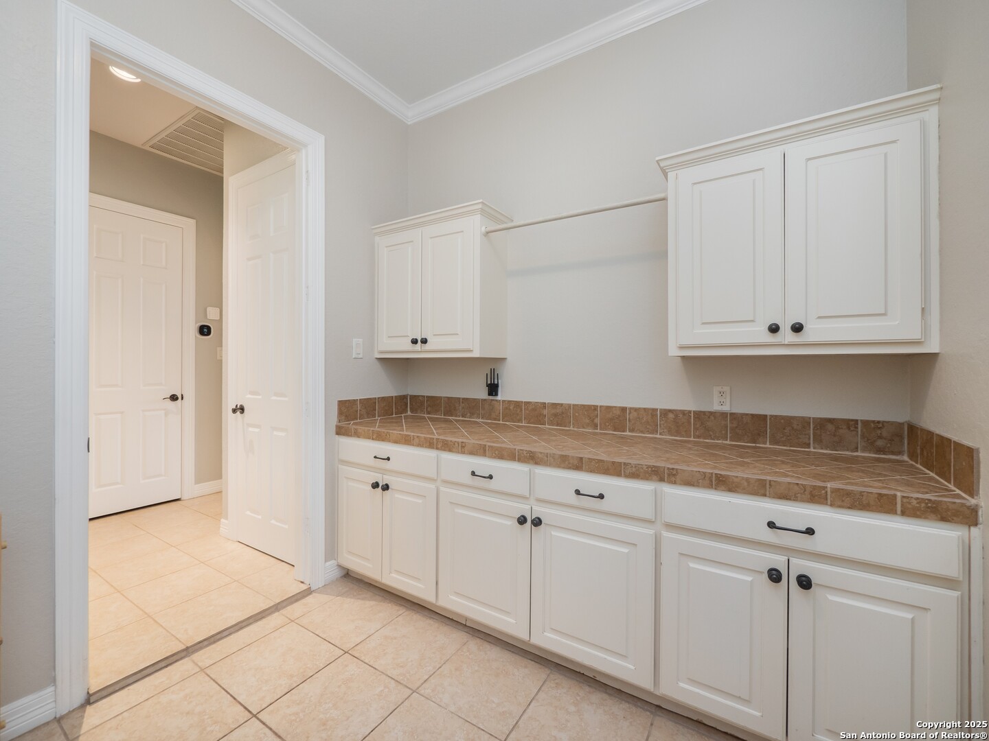 429 Fossil Hills Loop Spring Branch, TX 78070 - Photo 25 of 64 a kitchen with granite countertop white cabinets and sink