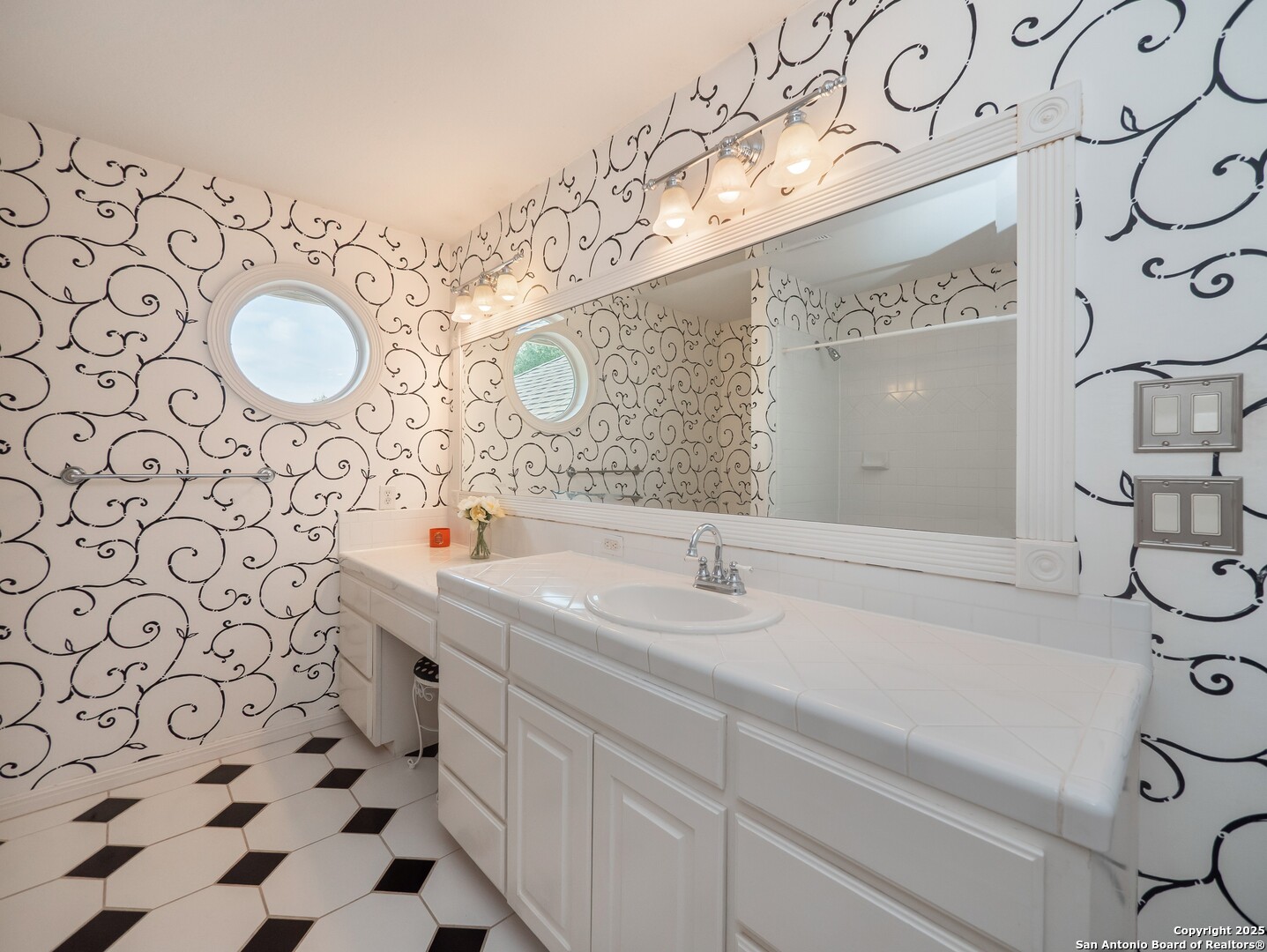 429 Fossil Hills Loop Spring Branch, TX 78070 - Photo 33 of 64 a bathroom with a sink mirror vanity and toilet