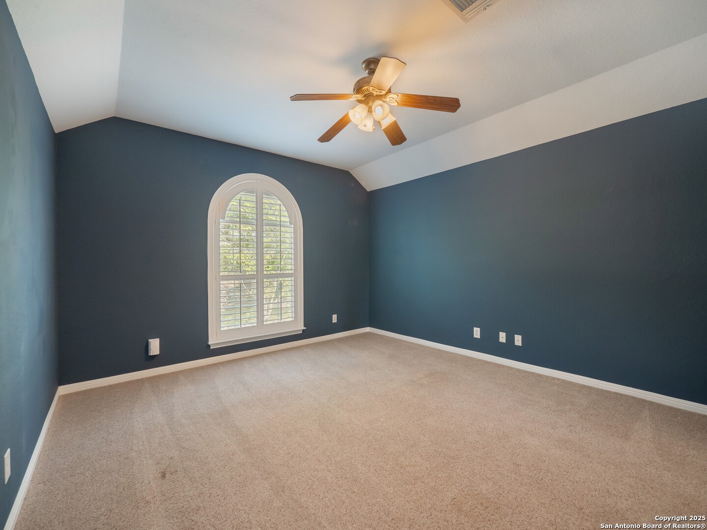 429 Fossil Hills Loop Spring Branch, TX 78070 - Photo 39 of 64 an empty room with chandelier fan and windows