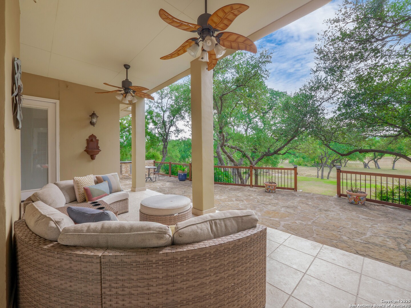 429 Fossil Hills Loop Spring Branch, TX 78070 - Photo 41 of 64 a living room with furniture and a floor to ceiling window