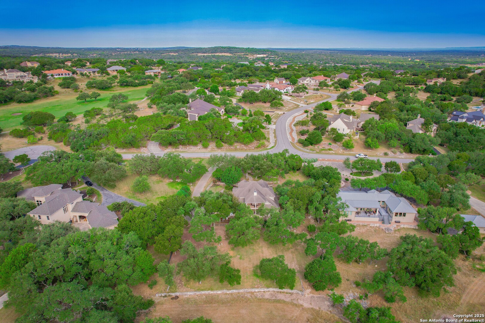 429 Fossil Hills Loop Spring Branch, TX 78070 - Photo 58 of 64 an aerial view of residential houses with outdoor space and trees