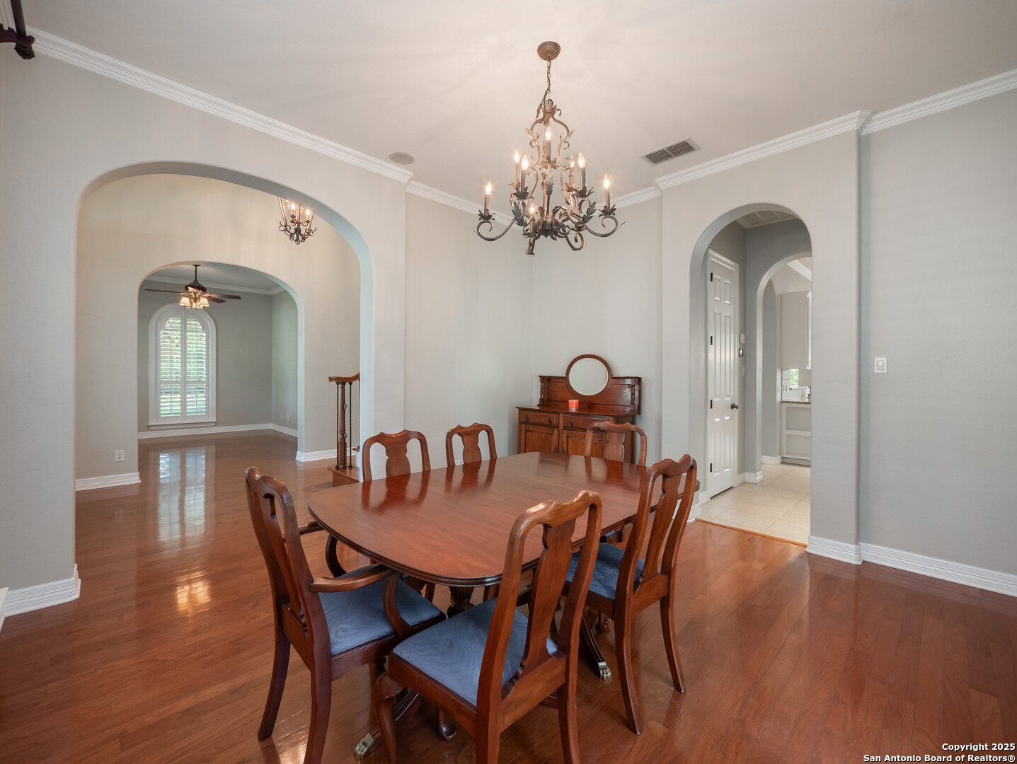429 Fossil Hills Loop Spring Branch, TX 78070 - Photo 7 of 64 a view of a dining room with furniture wooden floor and chandelier