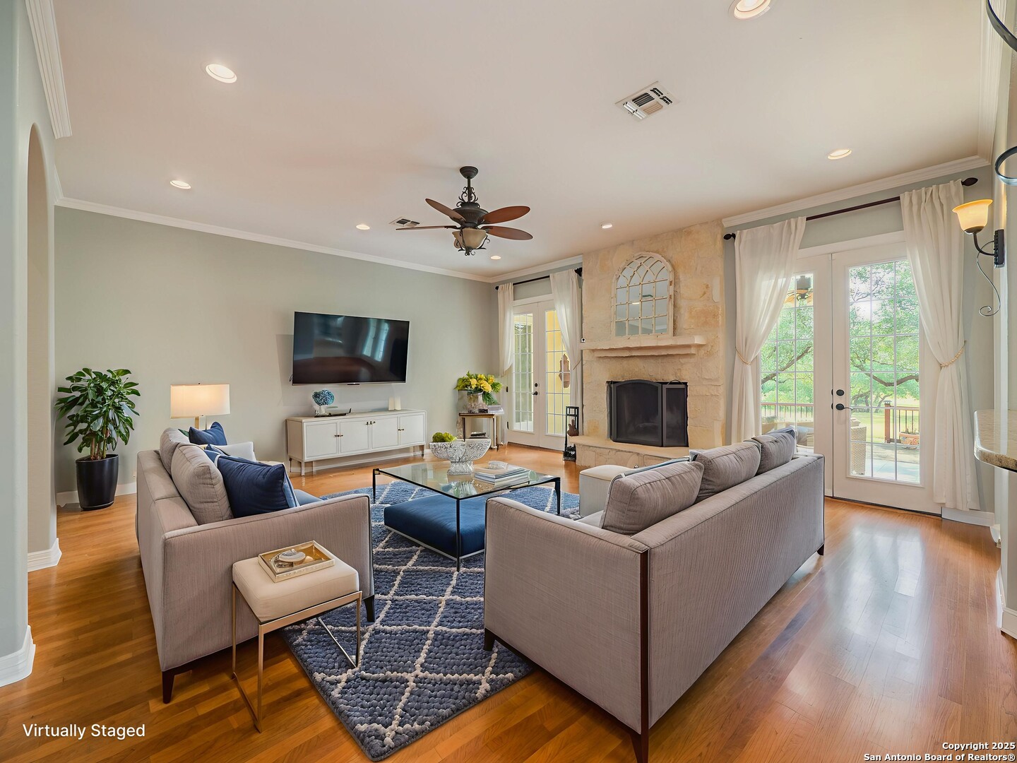 429 Fossil Hills Loop Spring Branch, TX 78070 - Photo 8 of 64 a living room with fireplace furniture and a flat screen tv