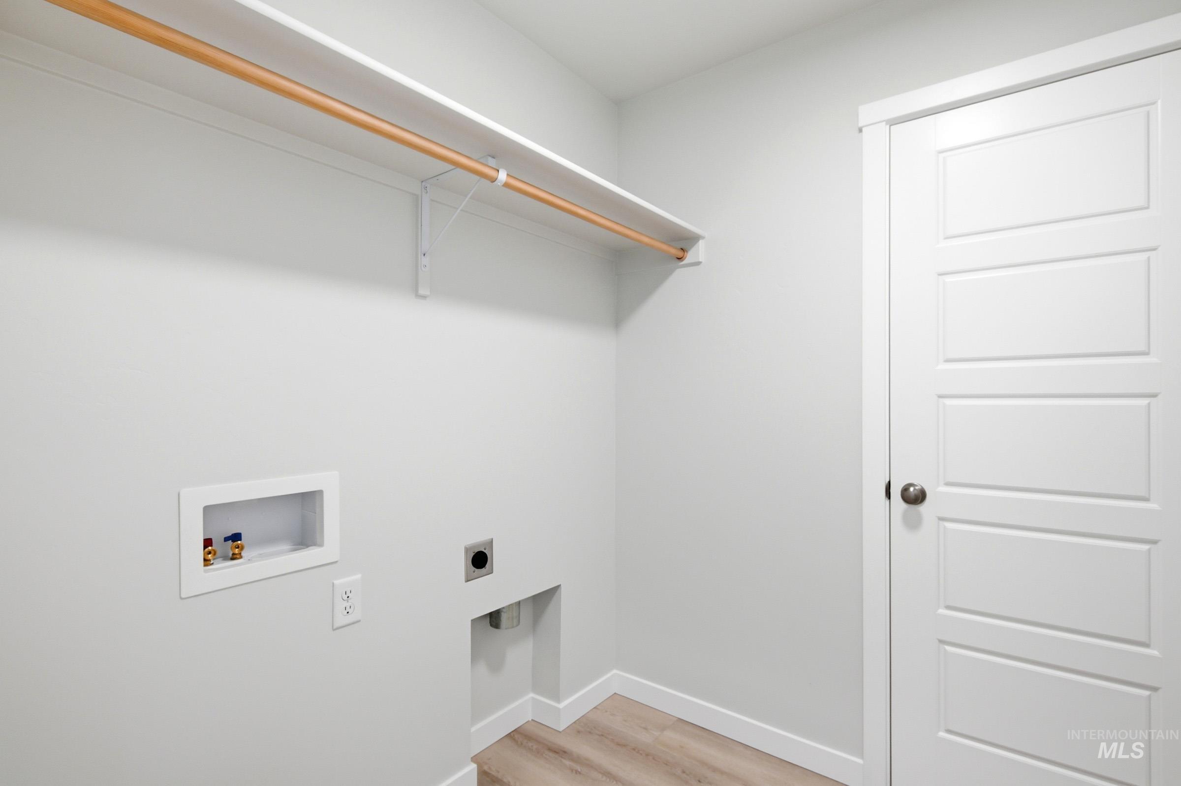 10812 Rutland Street Caldwell, ID 83605 - Photo 17 of 21 Dedicated utility space featuring light wood-finish flooring