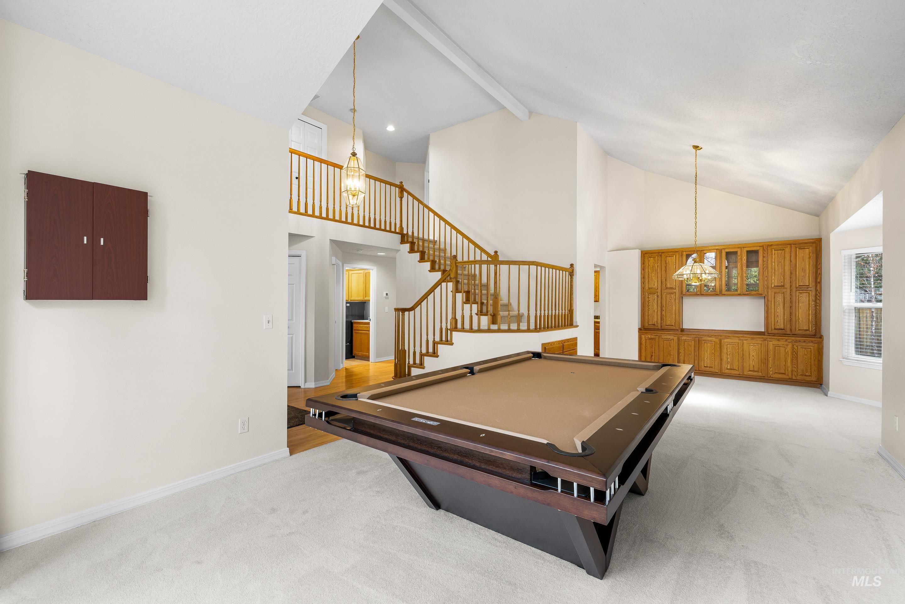 7736 West Bayhill Street Boise, ID 83704 - Photo 12 of 50 Playroom with beamed ceiling, pool table, high vaulted ceiling, light carpet, and a chandelier