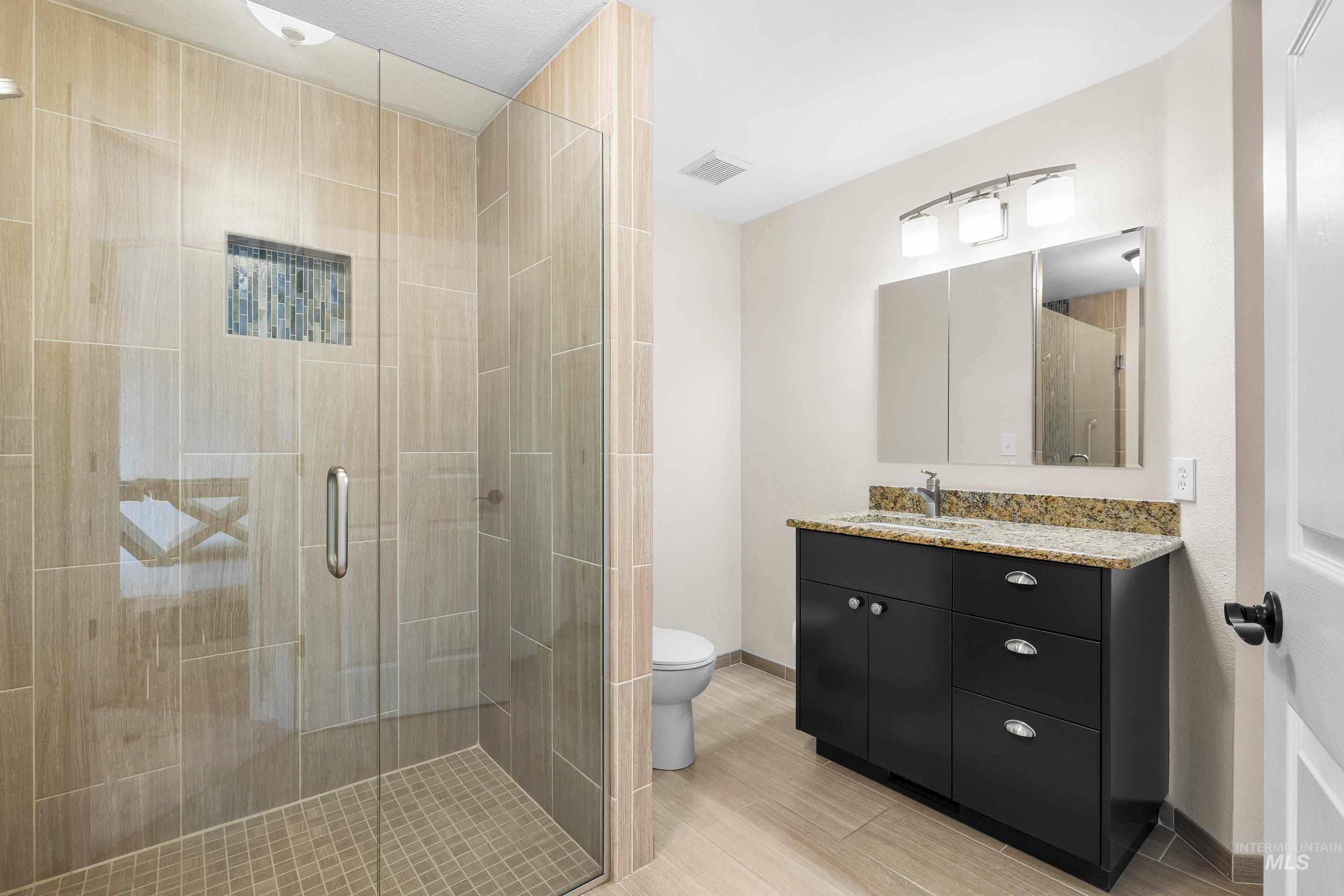 7736 West Bayhill Street Boise, ID 83704 - Photo 23 of 50 Bathroom with vanity and a stall shower