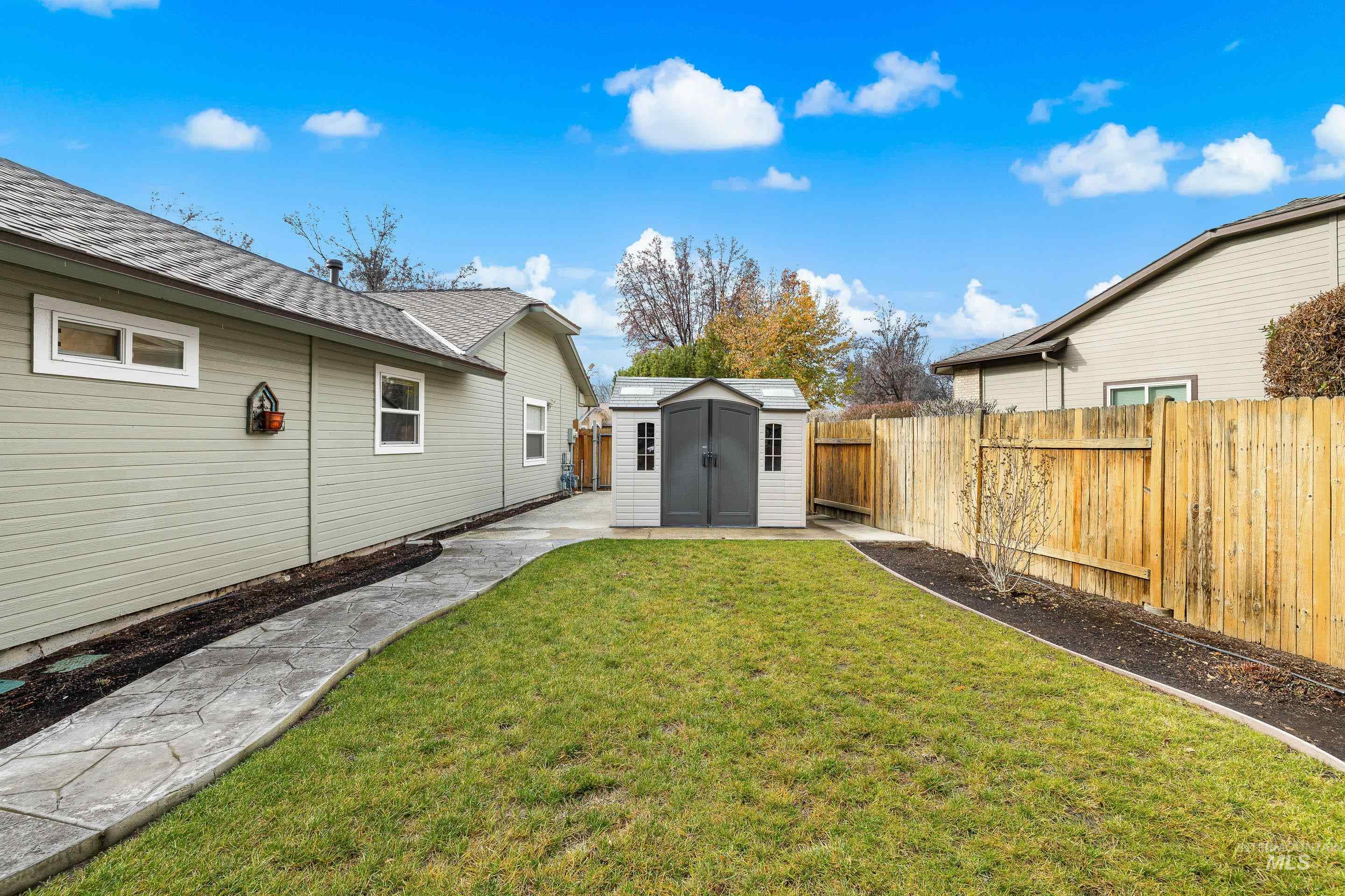 7736 West Bayhill Street Boise, ID 83704 - Photo 47 of 50 Fenced backyard with a storage shed and a patio area