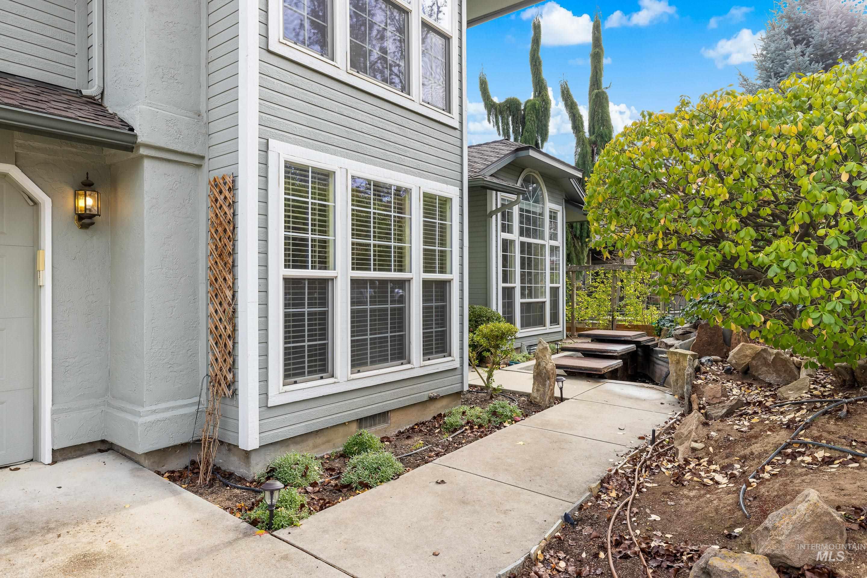 7736 West Bayhill Street Boise, ID 83704 - Photo 5 of 50 View of exterior entry featuring a shingled roof