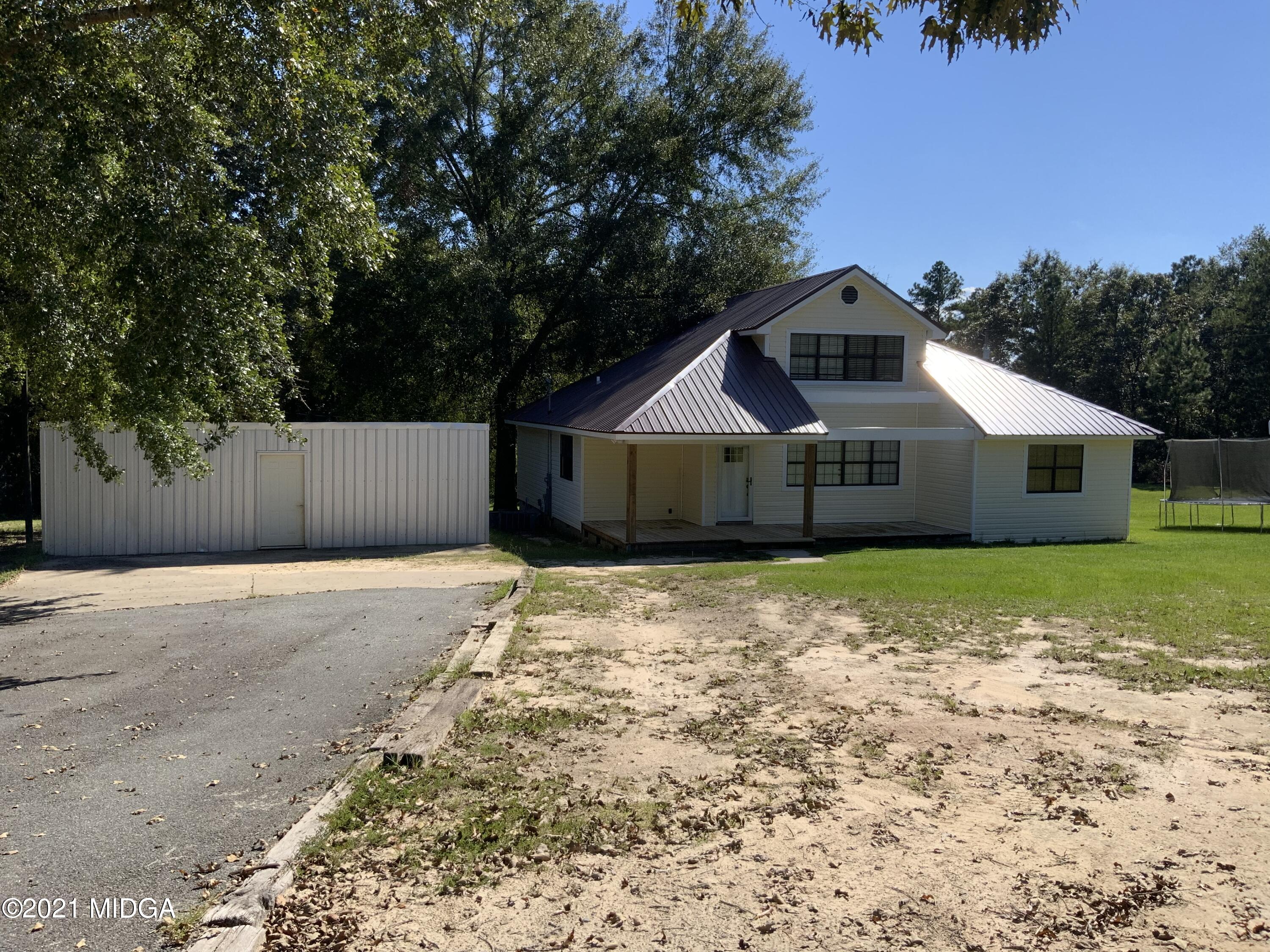 3482 Jordan Road Byron, GA 31008 - Photo 2 of 18 a front view of a house with a yard