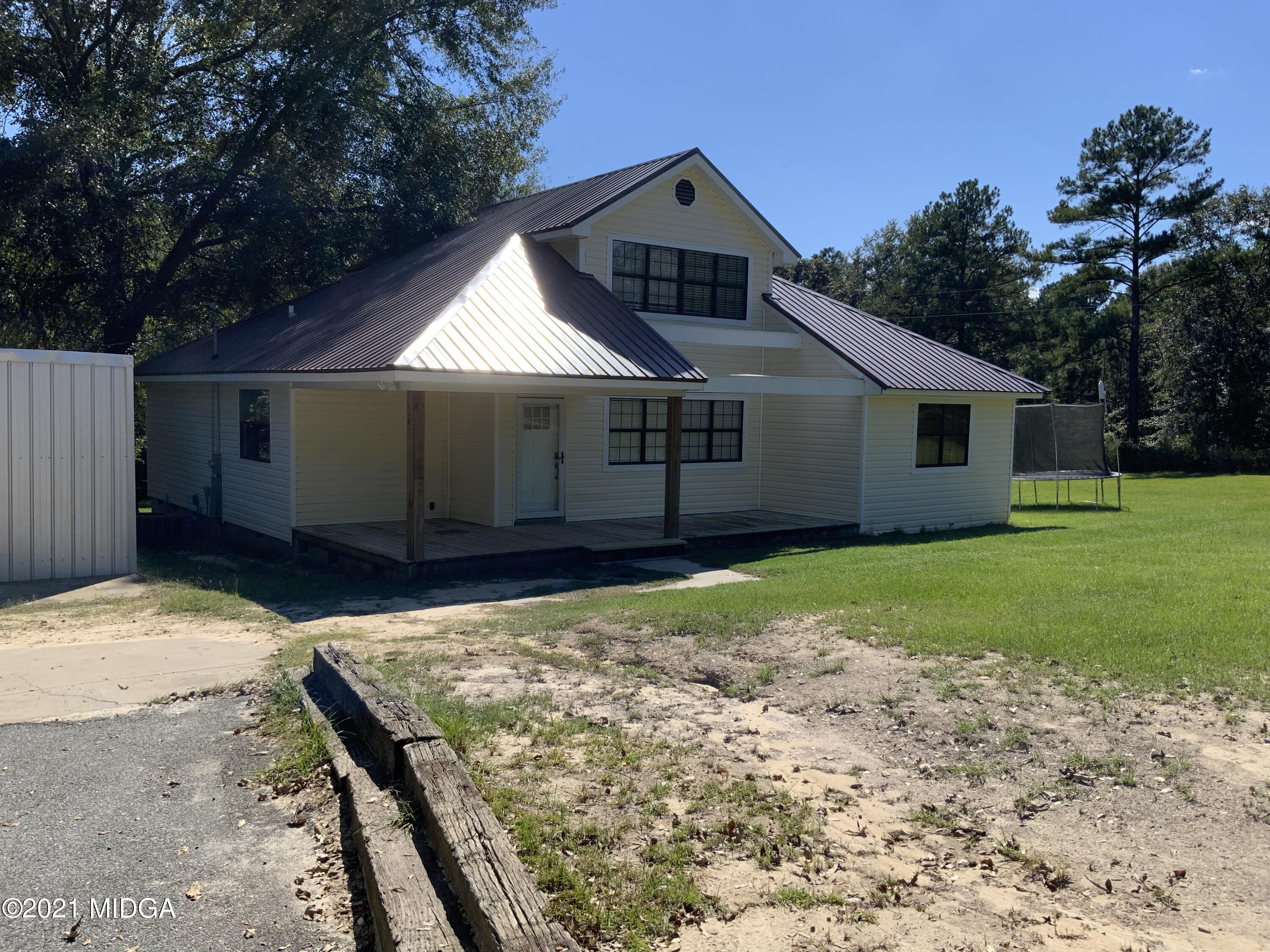 3482 Jordan Road Byron, GA 31008 - Photo 6 of 18 a view of a house with a yard