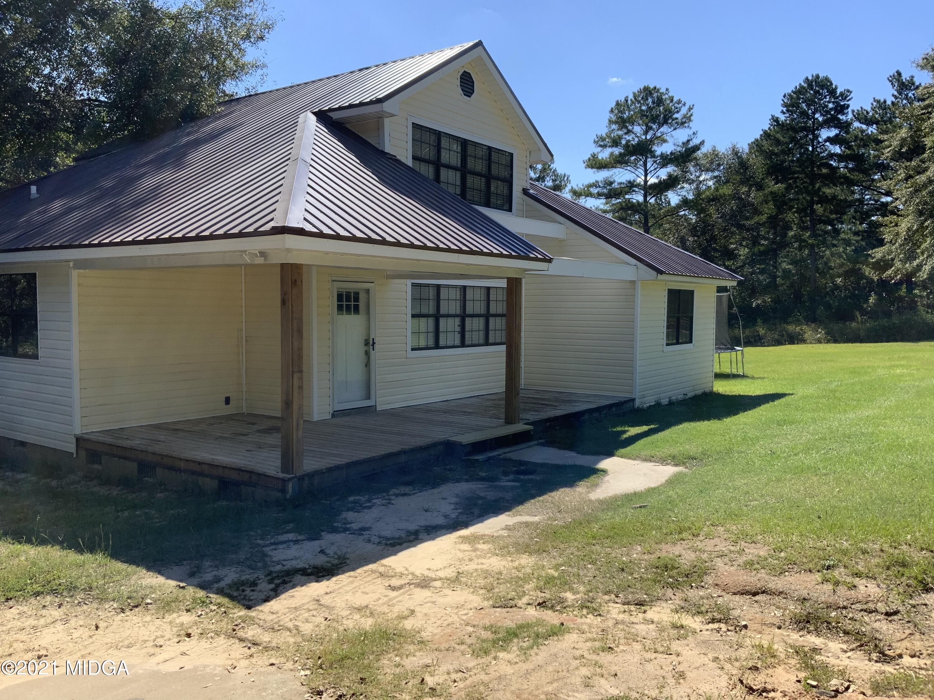 3482 Jordan Road Byron, GA 31008 - Photo 7 of 18 a view of a house with a yard
