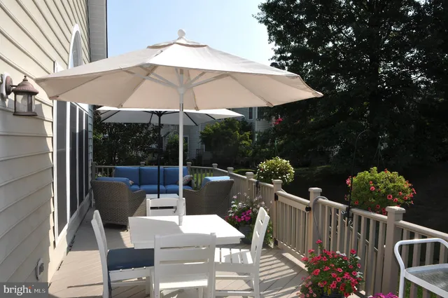 a view of a chairs and table under an umbrella