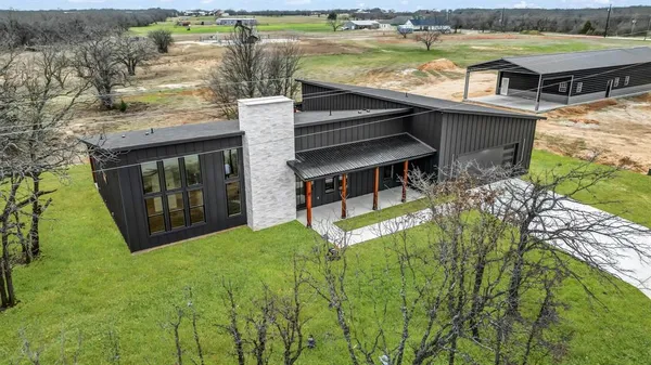 a view of swimming pool with outdoor seating and yard