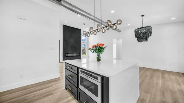a view of a hallway with a chandelier