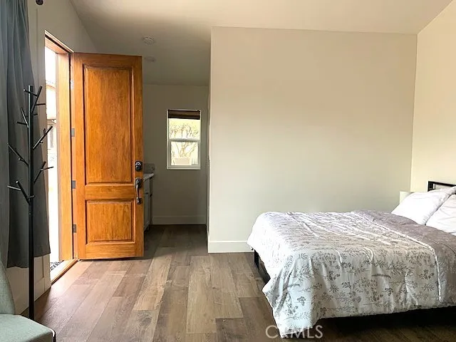 a bedroom with a bed and a chair