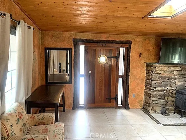 a view of a hallway with furniture and front door