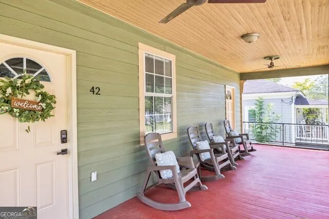a dining room with furniture and wooden floor