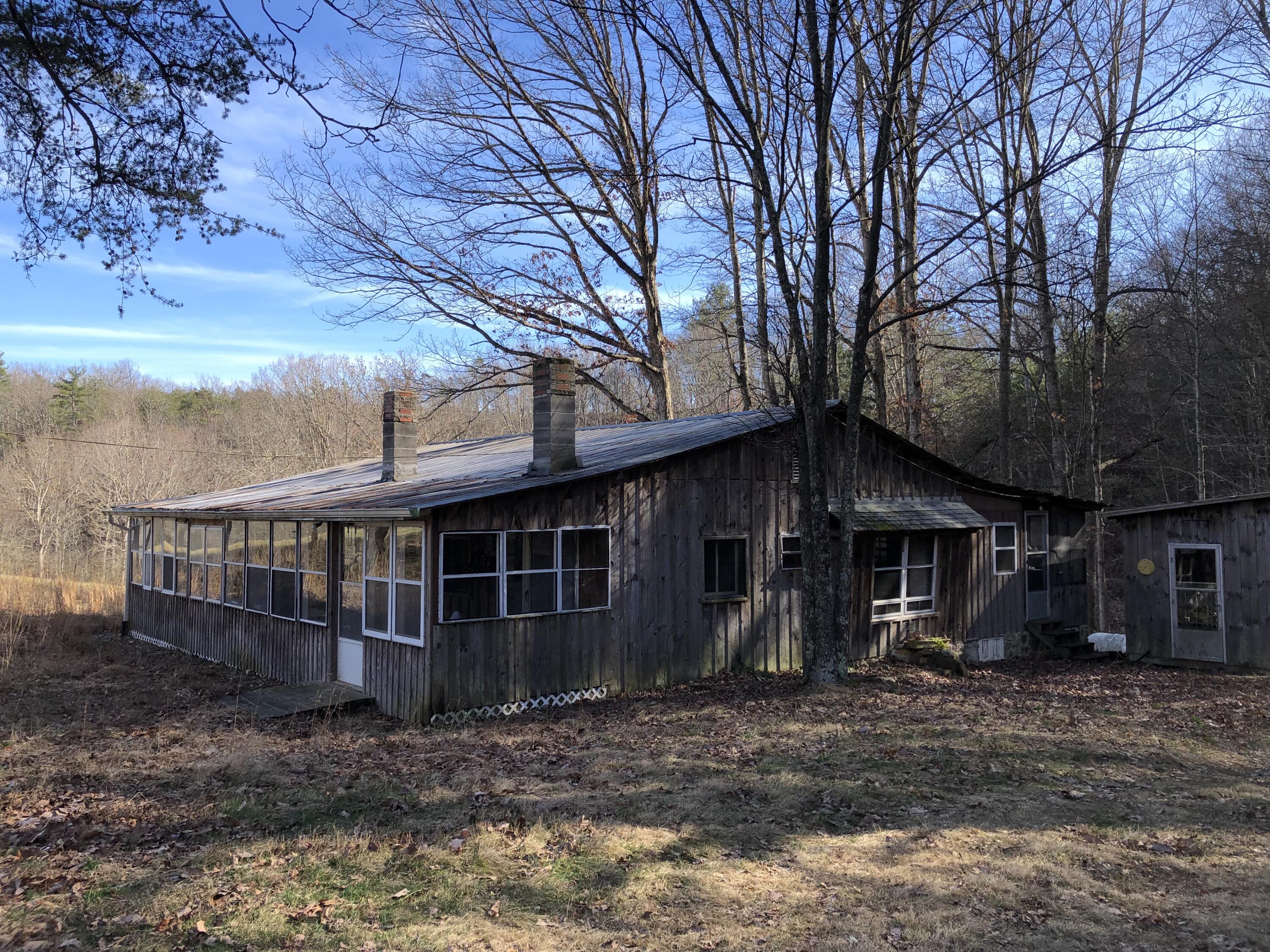 906 Wolfe Road Covington, VA 24426 - Photo 31 of 50 a view of a house with a yard and large tree
