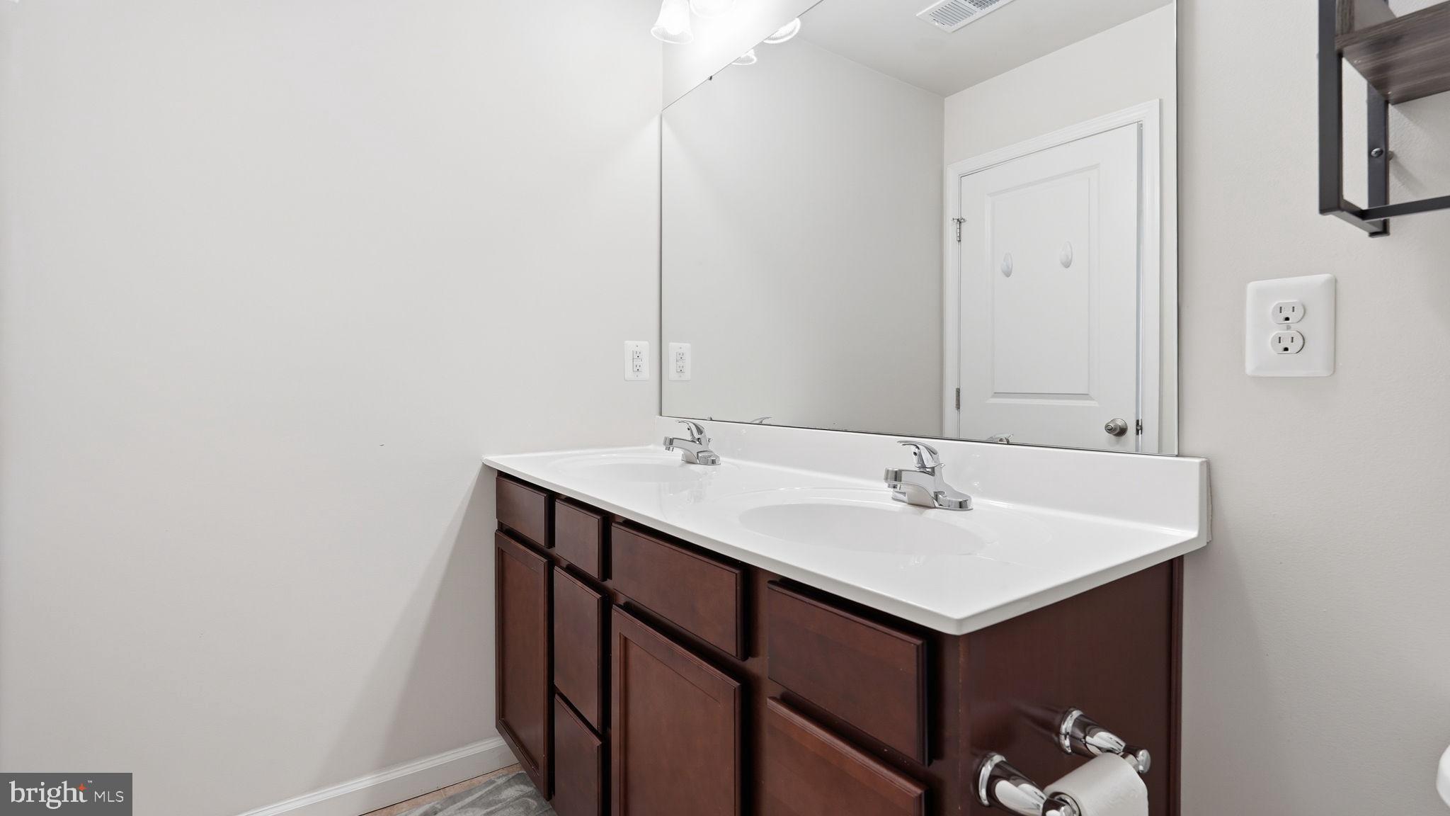 2402 Butternut Lane Culpeper, VA 22701 - Photo 23 of 36 a bathroom with a sink and a mirror