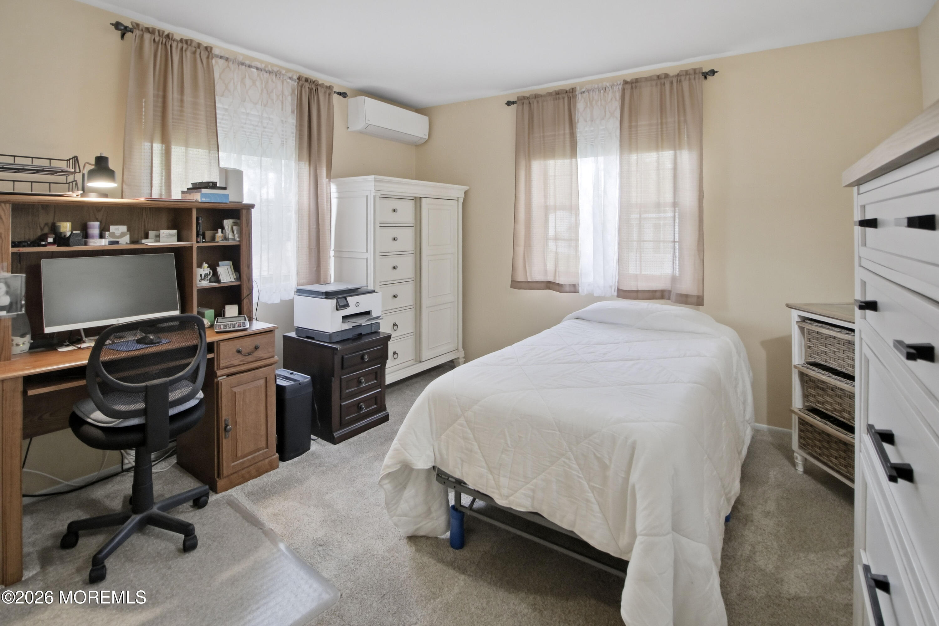 22 A Roosevelt City Road Whiting, NJ 08759 - Photo 11 of 18 a bedroom with a bed and a computer on the desk